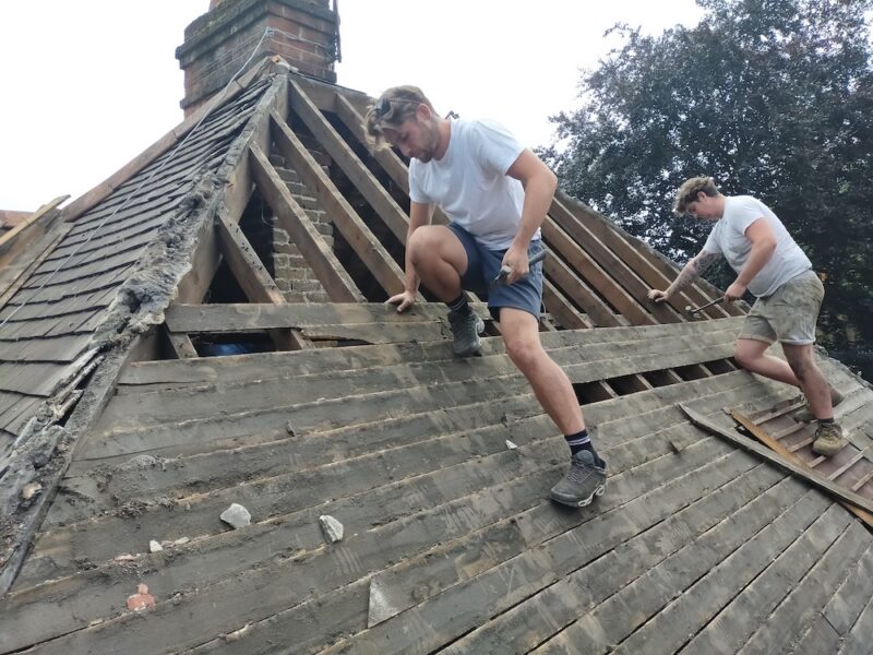 Armadillo Roofing team removing old roof