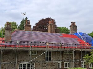 Clay tile roof restoration of a 300-year-old manor by NFRC-accredited Armadillo Roofing. Check our verified reviews and see our expert craftsmanship.