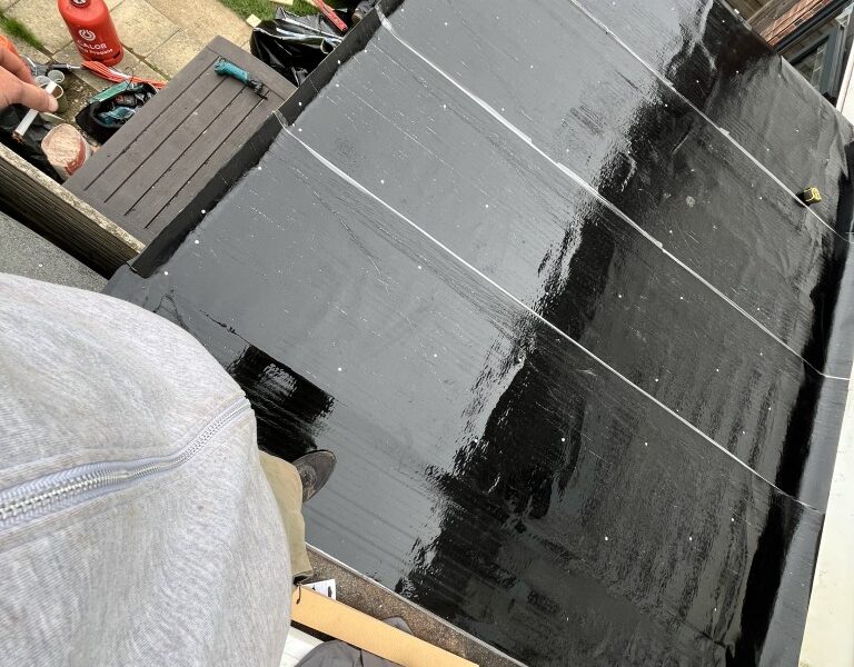 Flat roof leaking through to the room below